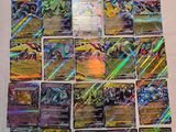 a bunch of pokemon cards sitting on top of a table