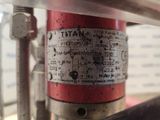 a close up of a red fire hydrant on a table