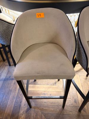 pair of chairs in a store with a price tag on the back of the chairs