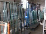 many pieces of glass in a room with a ladder