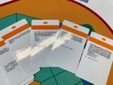 several cards are sitting on a table with scissors and a pair of scissors