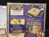 a box with a board game inside of it on a table