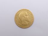 an image of a close up of a gold coin on a white surface
