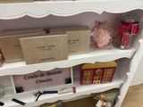 a shelf that has a lot of items on it
