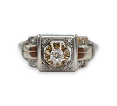 a close up of a diamond ring on a white background