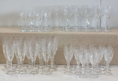 a lot of wine glasses sitting on a table