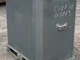 a metal box with a sign on it sitting in the dirt