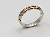a close up of a gold ring on a white background