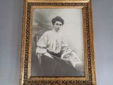 a picture of a woman that is sitting in a chair