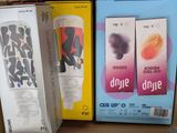 three boxes of different flavored drinks on a shelf