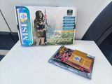 a box with a video game and a game controller on a table