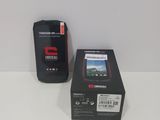 a cell phone that is sitting next to a box