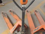 two orange pallets sitting next to each other on the floor