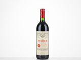 a bottle of red wine sitting on top of a table