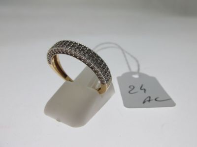 a close up of a ring on a white surface with a price tag