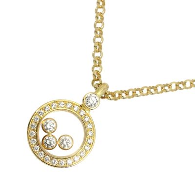 a close up of a gold necklace with diamonds on a white background