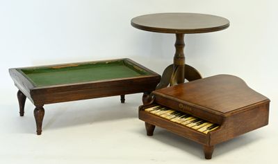 a small table with a piano and a small table with a piano on it