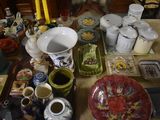 a table with a lot of dishes and cups on it