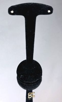 a black ring holder that has a ring on it