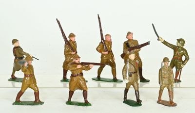 a lot of figurines of soldiers that are on a table