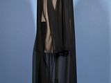 a mannequin wearing a black dress on a mannequin stand