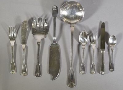 a lot of silver spoons and silverware on the table