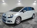 a picture of a white minivan parked on a checkered floor