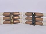 cigarettes are lined up in a row on a white surface