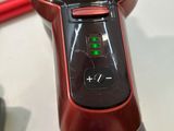 a close up of a red and black device on a table