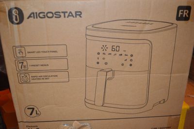 emballage d'une friteuse à air chaud posé sur une boîte en carton