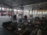 a large warehouse with a lot of equipment in it
