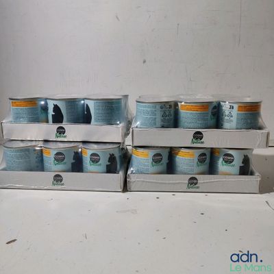 several cans of soda are stacked on top of each other on a counter