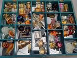 many different types of perfumes in a blue box