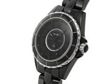 the watch is black in color and has a black face