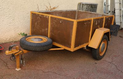 a small trailer with a trailer attached to it