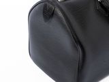 an image of a black purse on a white background