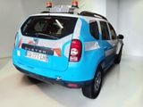 a picture of a blue and white car in a garage