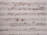 an old sheet of music with music notes on it