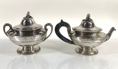 pair of silver plated teapots with handles and handles