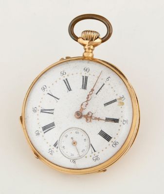 a gold pocket watch with roman numerals on the face