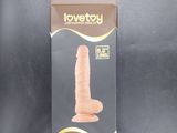 a box of love toy with a large dille inside of it