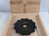 a box with a circular blade in it on a table