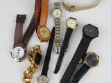 many different types of watches and watches on the table