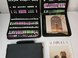 a black case that has a book, a book, and a pen on it