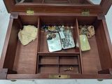 a small wooden box with a mirror and a pair of scissors in it