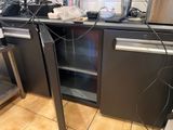 an image of a kitchen with a lot of wires on the counter