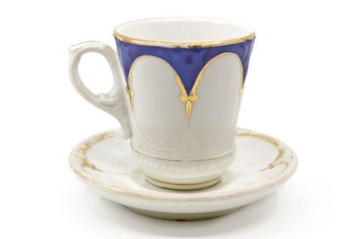 a cup and saucer on a saucer on a white surface