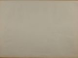 an old photo of a piece of paper hanging on a wall