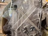 a lot of plastic items in a box on the floor