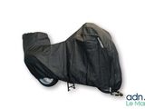the motorcycle cover is black and has a zipper on the side